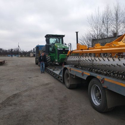 JD 8360RT & Gascon subsoiler delivered from UK & Spain to farm in Ukraine